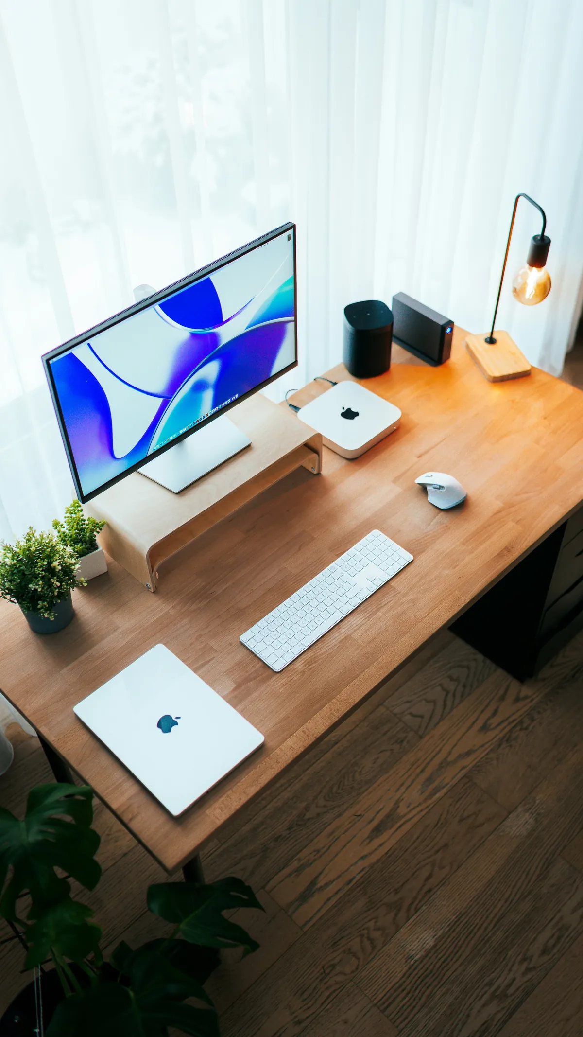 Desk with a monitor, laptop and keyboard